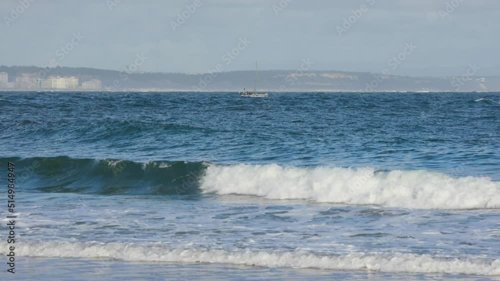 small boat moving in front of Costa da Caparica near Lighthouse of Torre do Bugio. Lisbon Guide Light. View from Fort São Julião da Barra Lighthouse. small boat moving in front of Costa da Caparica near Lighthouse of Torre do Bugio. Lisbon Guide Light. View from Fort São Julião da Barra Lighthouse.