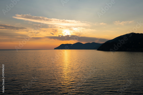 Beautiful sunset at the Mediterranean Sea in Italy. Vacation feeling during sunrise and sunset