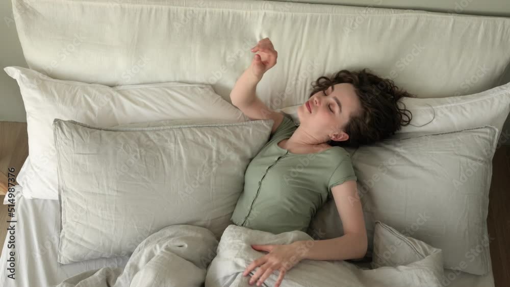 Young beautiful woman sleeping in cozy bed Young beautiful woman sleeping in cozy bed