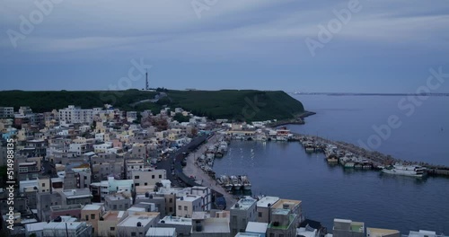 Penghu, Taiwan Xiyu township fishing village in Penghu of Taiwan at sunset photo