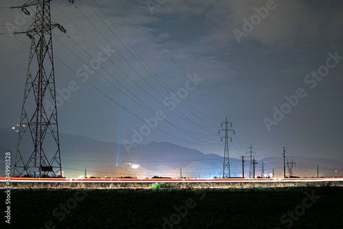 Wallpaper Mural high voltage power lines at night with mountain view and car trails Torontodigital.ca