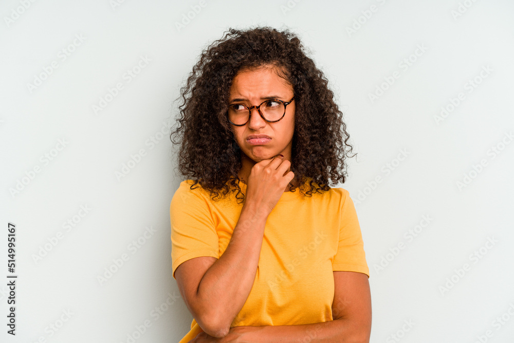 Young Brazilian woman isolated on blue background suffers pain in throat due a virus or infection. Young Brazilian woman isolated on blue background suffers pain in throat due a virus or infection.