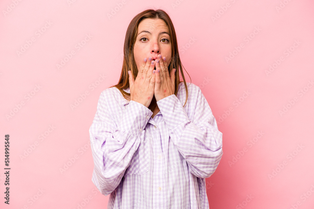 Young caucasian pregnant woman isolated on white background shocked, covering mouth with hands, anxious to discover something new. Young caucasian pregnant woman isolated on white background shocked, covering mouth with hands, anxious to discover something new.