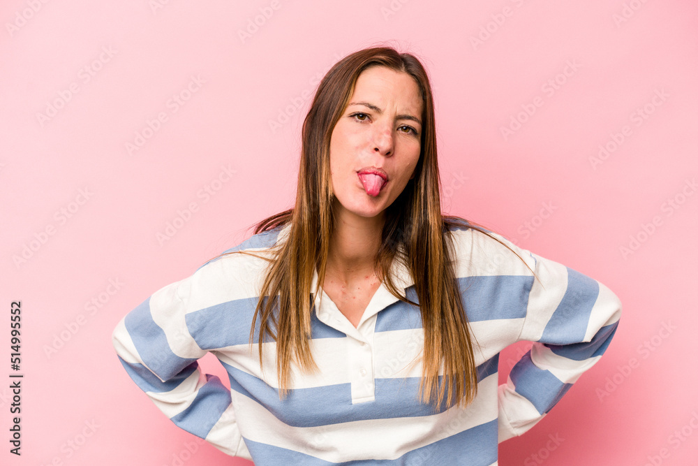 Young caucasian pregnant woman isolated on white background funny and friendly sticking out tongue. Young caucasian pregnant woman isolated on white background funny and friendly sticking out tongue.