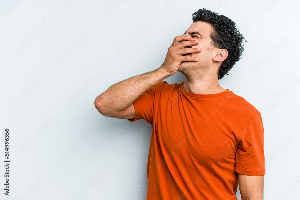 Young caucasian man isolated on blue background laughing happy, carefree, natural emotion. Young caucasian man isolated on blue background laughing happy, carefree, natural emotion.