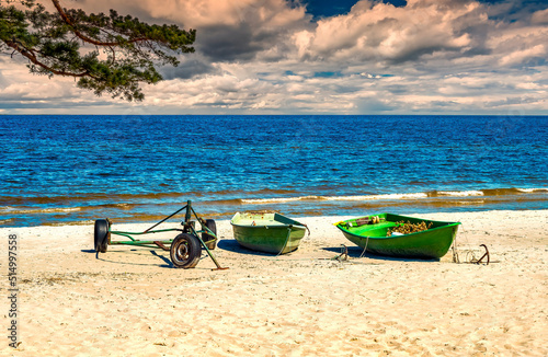 Coastal landscape with fishing boats, anchors and tradition tackles near vill...