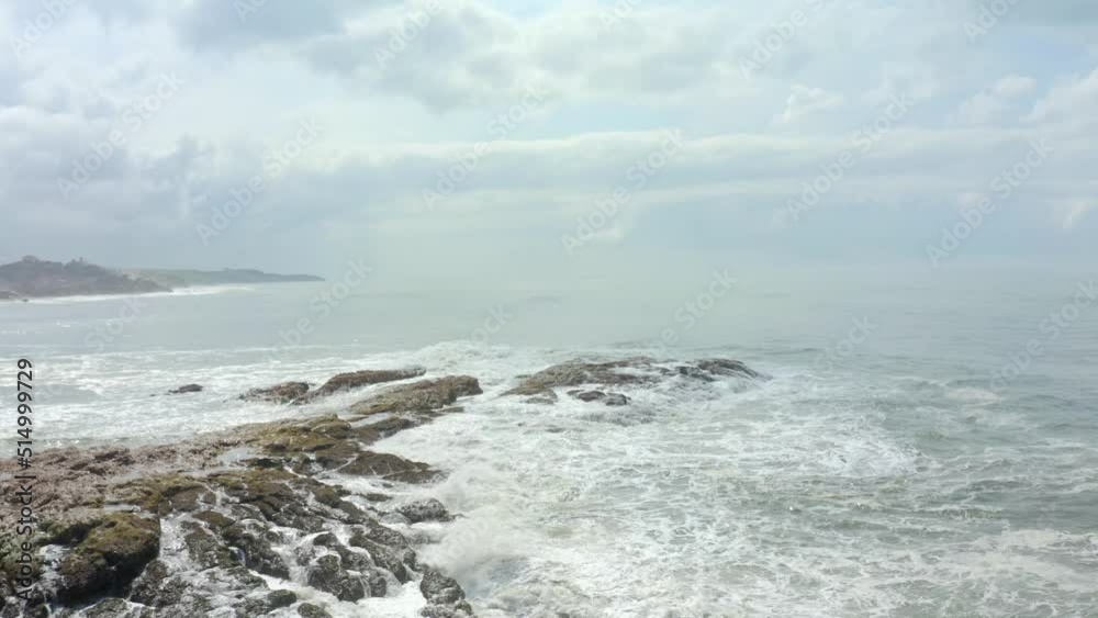 awesome shot of waves hitting rock in the sea awesome shot of waves hitting rock in the sea