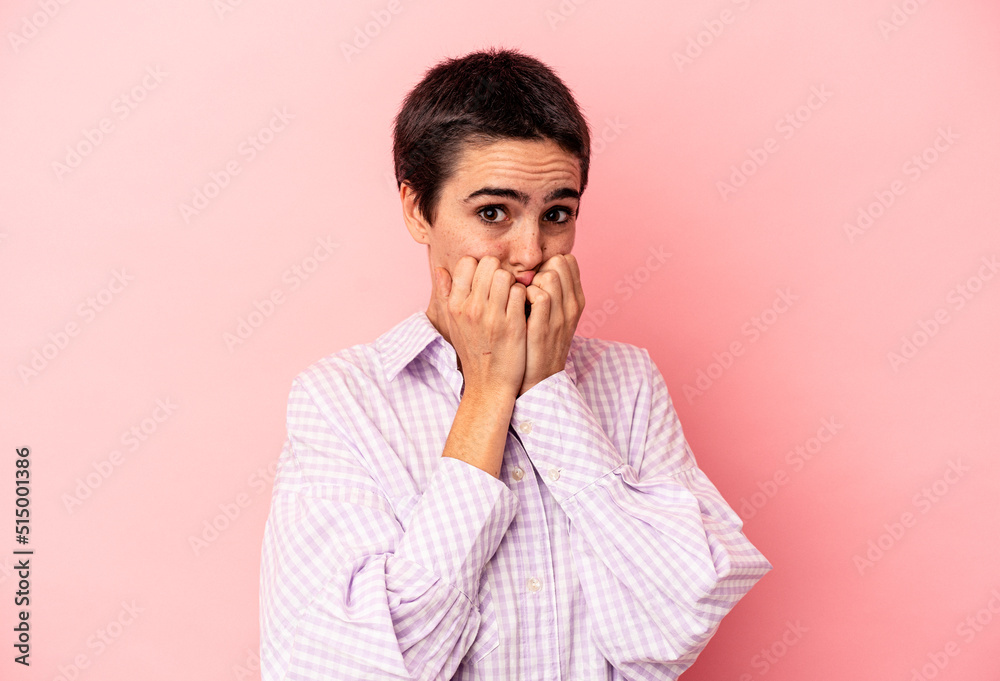 Young caucasian woman isolated on blue background biting fingernails, nervous and very anxious. Young caucasian woman isolated on blue background biting fingernails, nervous and very anxious.