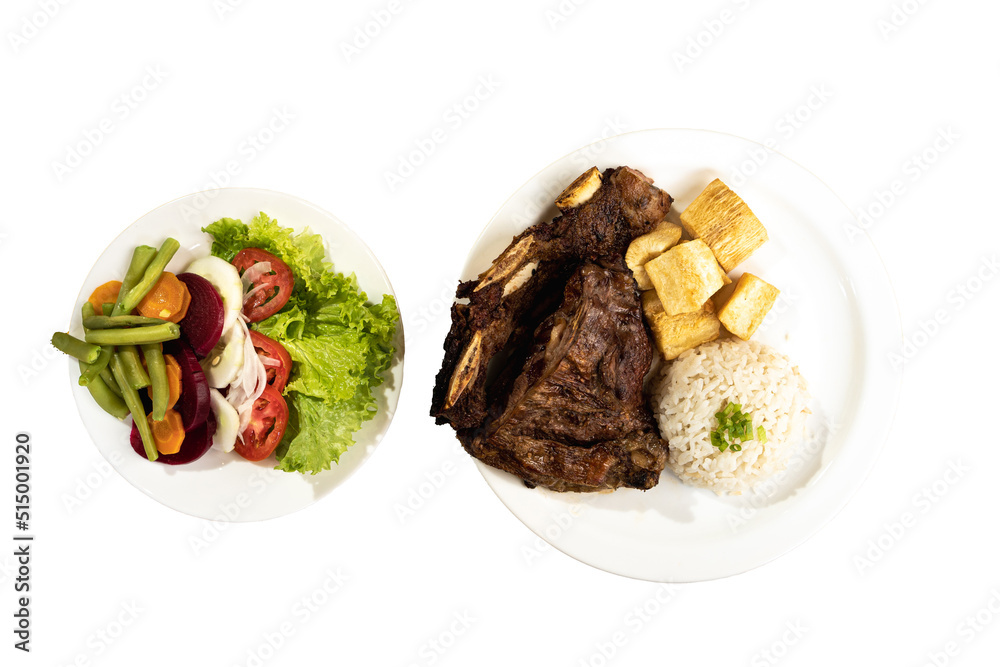 Grilled churrasco meat, with rice, yucca and salad on the side Grilled churrasco meat, with rice, yucca and salad on the side