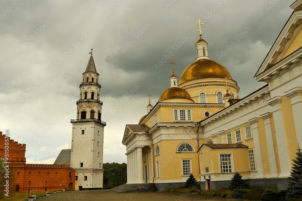 Cloudy day, Orthodox church and old factory tower
