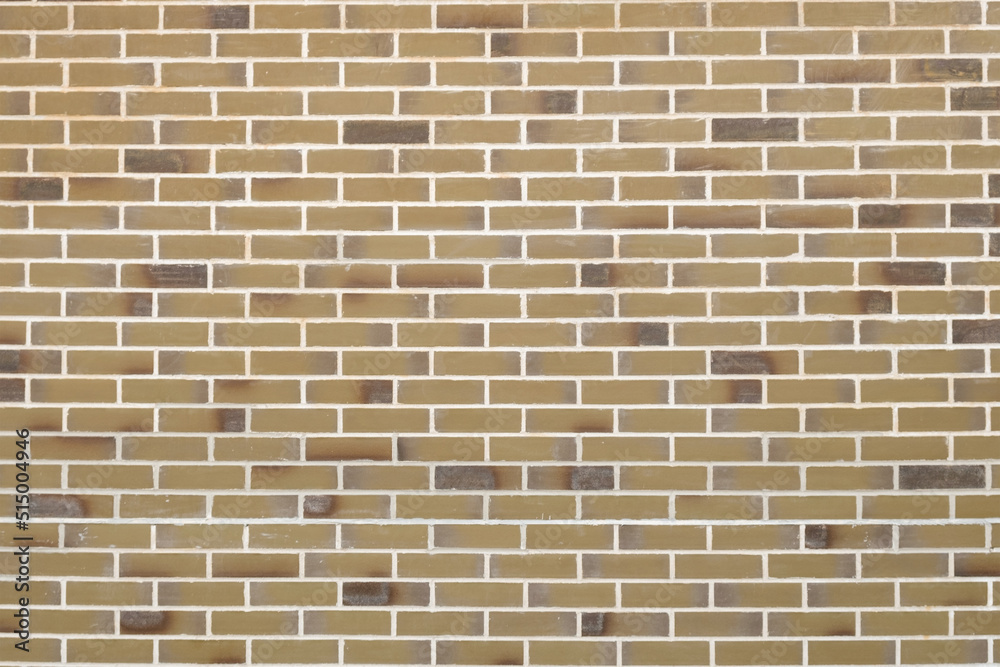 Texture of the wall, lined with smooth facing bricks. Texture background material construction. Pattern for designers.