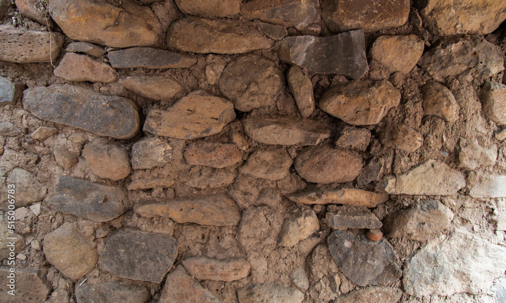 Rock or stone wall bricks pasted with mud. Wall texture and background. Rock or stone wall bricks pasted with mud. Wall texture and background.
