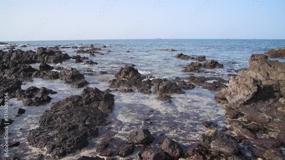 Rocks showing at low tide, one beach of Masirah Island, Sultanate of Oman, Middle East, Arabian Peninsula Rocks showing at low tide, one beach of Masirah Island, Sultanate of Oman, Middle East, Arabian Peninsula