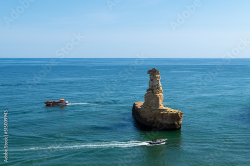 Boats on the beautiful Praia Nova in Porches on the Algarve in Portugal.