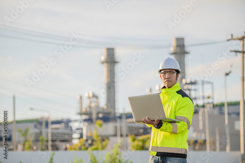 Asian man petrochemical engineer working at oil and gas refinery plant industry factory,The people worker man engineer work control at power plant energy industry manufacturing © reewungjunerr