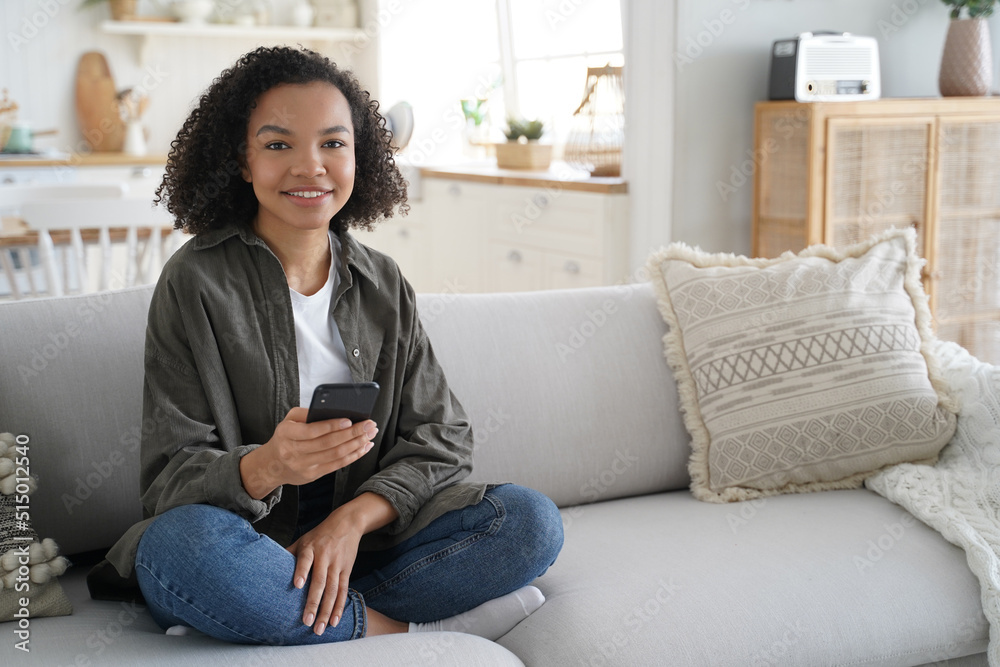 Young hispanic woman is browsing social media. Online book reading. Lazy weekend morning. Young hispanic woman is browsing social media. Online book reading. Lazy weekend morning.