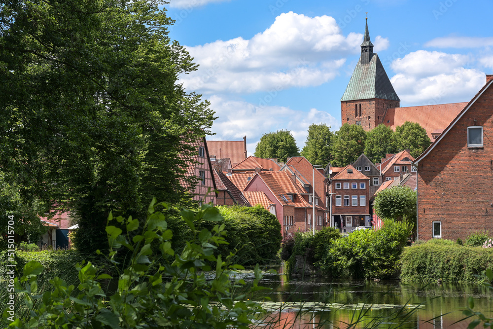 Old town with typical red brick buildings and St. Nikolai church of the medieval small city Moelln in Schleswig-Holstein, Germany, blue sky with clouds, copy space Old town with typical red brick buildings and St. Nikolai church of the medieval small city Moelln in Schleswig-Holstein, Germany, blue sky with clouds, copy space