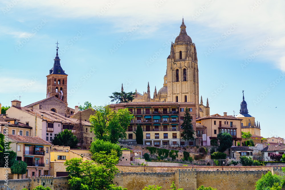 Skyline of the city of Segovia with its medieval buildings rising to the sky.