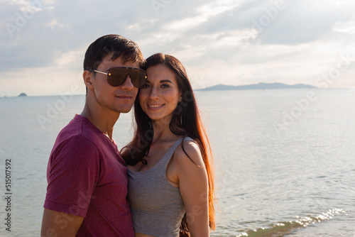 Portrait of Caucasian couple in casual style embrace at outdoor together in summer time. people travel vacation to the beach. happy lifestyle © winnievinzence