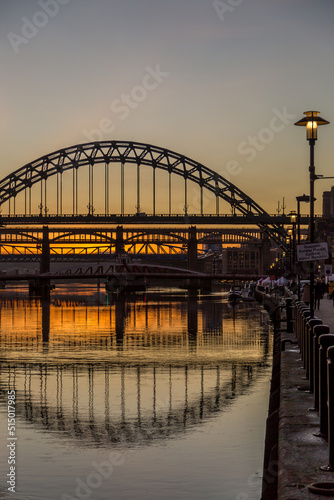 The Tyne Bridge in Newcastle at sunset  reflecting in the almost still River Tyne beneath