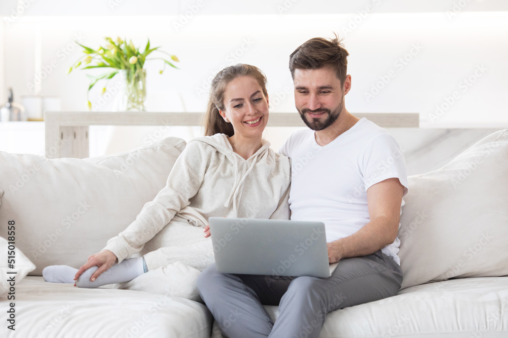 Happy married couple with laptop Happy married couple with laptop