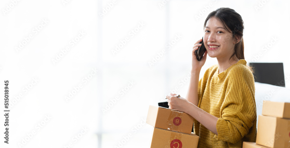 Starting small businesses SME owners female entrepreneurs check online orders to prepare to pack the boxes, sell to customers, sme business ideas online. Starting small businesses SME owners female entrepreneurs check online orders to prepare to pack the boxes, sell to customers, sme business ideas online.