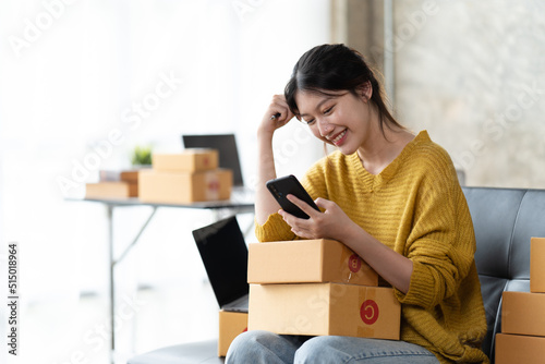 Starting small businesses SME owners female entrepreneurs check online orders to prepare to pack the boxes, sell to customers, sme business ideas online. © PaeGAG