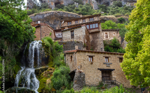 Bonito pueblo. Un arroyo atraviesa la localidad en una cascada que desemboca en el río Ebro. Orbaneja del Castillo, Burgos, España. photo