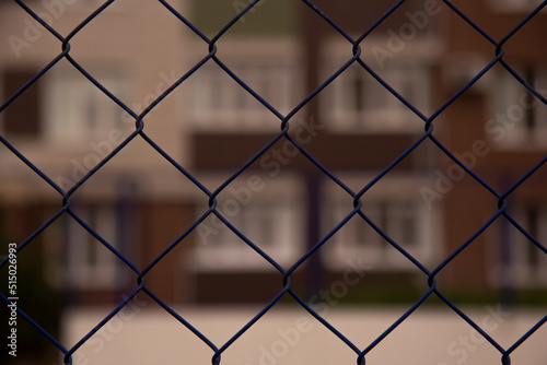 Blurred background behind metal bars. Closed. Ban