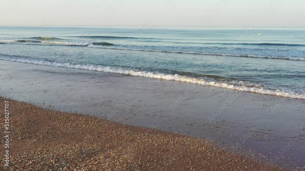 aerial view over the waves of the sea on a beach aerial view over the waves of the sea on a beach