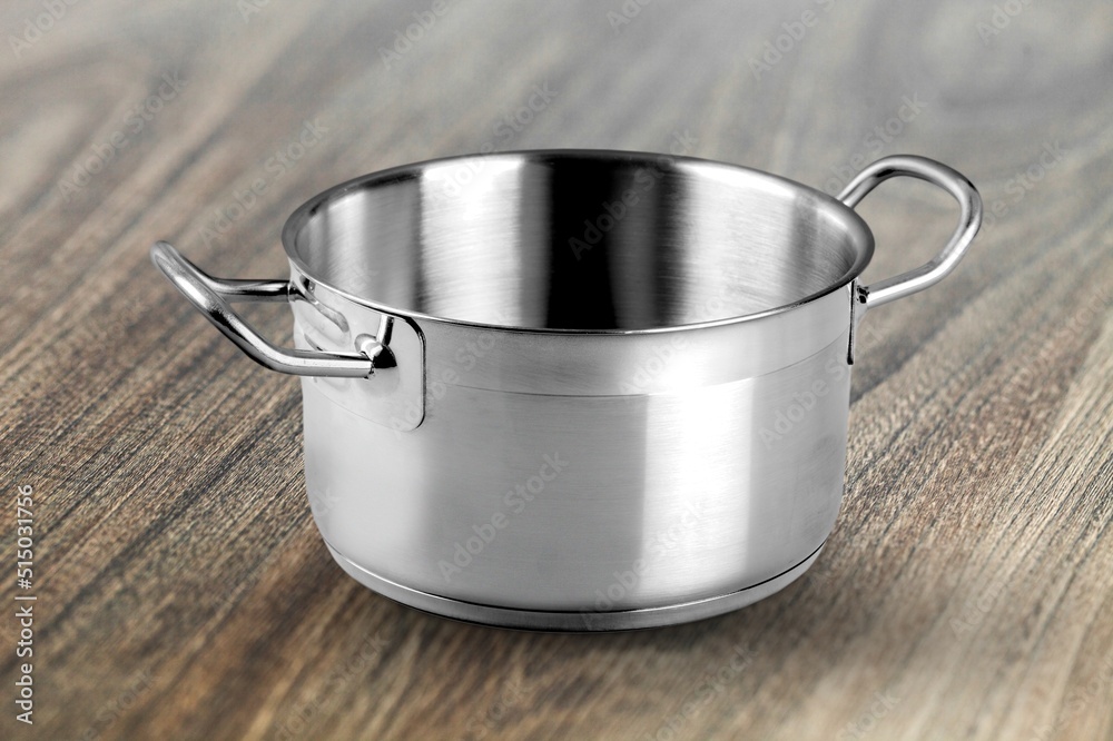 Classic steel pan with a non-stick coating on the desk Classic steel pan with a non-stick coating on the desk