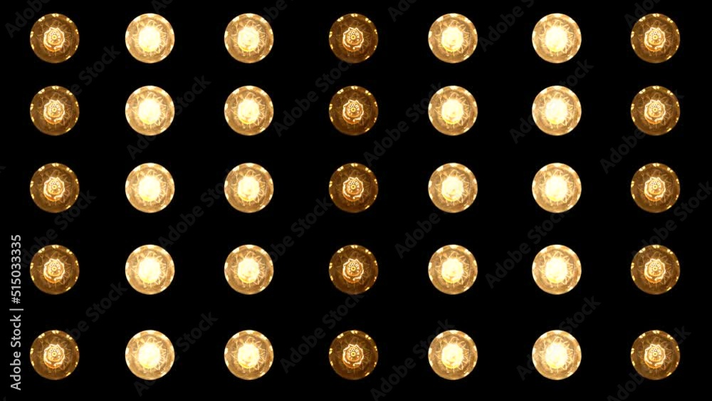 Looped VJ background, flashing spotlights. Stage back. Halogen or spiral incandescent blinking lamps. A matrix of flashing disco spotlights. Black background.