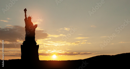 Silhouettes of The Statue of Liberty at sunset. Greeting card for Independence Day.