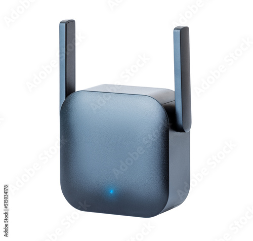 Black wi-fi range extender with small antennas, plugged into an electrical outlet. Isolated with clipping path on white background photo