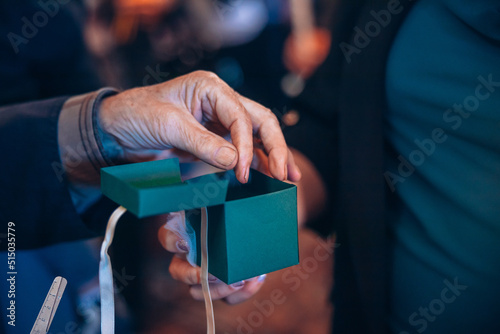 Fotografie A priest is putting a baby's cut hair in a box for safe keeping at an orthodox baptism