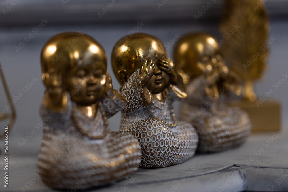 Fototapeta premium Three Wise little Buddha figurine in a row, Hear no evil, See no evil, Speak no evil,