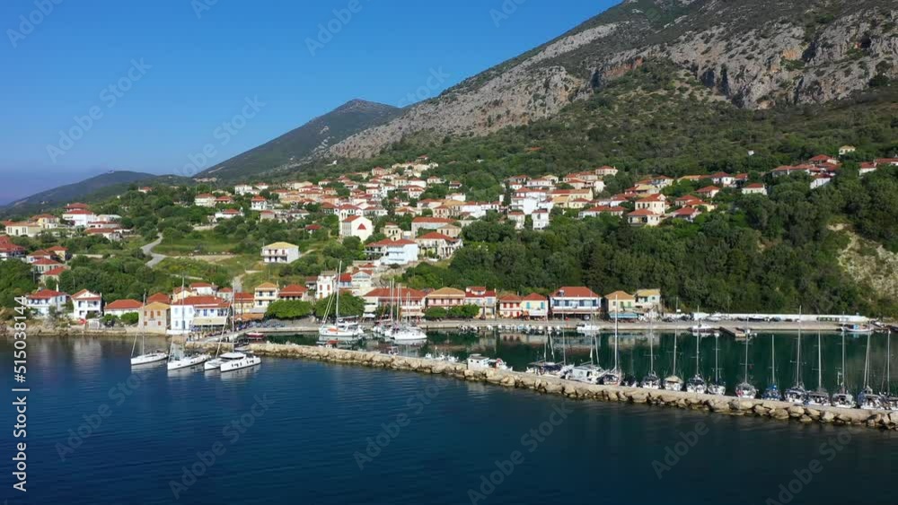 Small marina with catamaran yachts and sailboats in Greece. Kalamos Marina. Beautiful and cozy harbor in Greece. Old fishing village with port on the shore of the Ionian Sea. Travel by boat on the sea Small marina with catamaran yachts and sailboats in Greece. Kalamos Marina. Beautiful and cozy harbor in Greece. Old fishing village with port on the shore of the Ionian Sea. Travel by boat on the sea