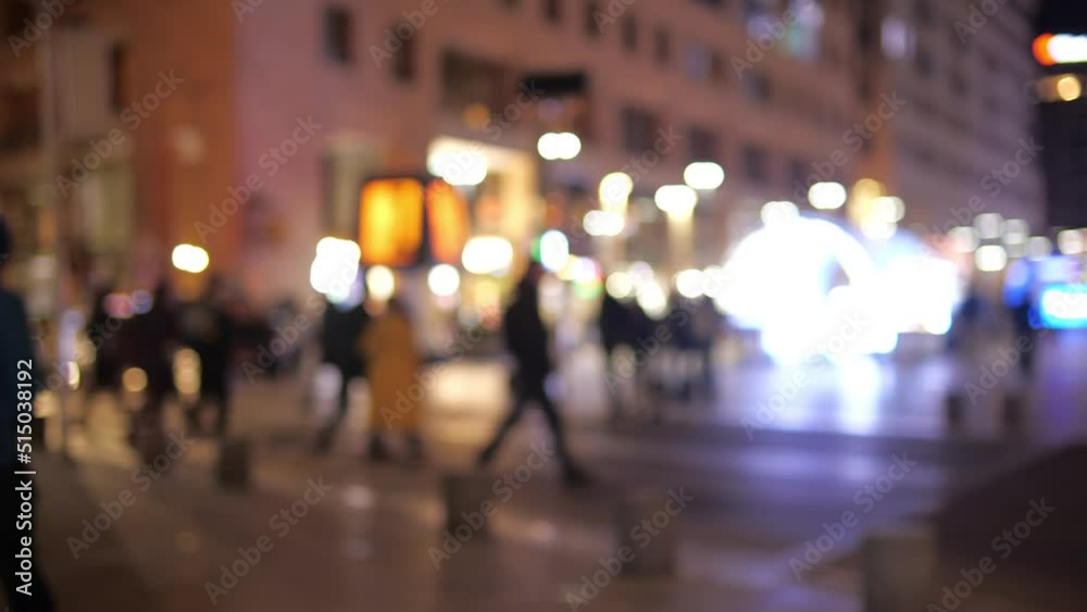 City nightlife concept. Crowd of people moving on the night street City nightlife concept. Crowd of people moving on the night street