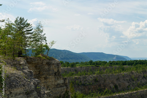 landscape with sky and clouds.green pine trees in the mountains. beautiful view from the top of the mountain on summer day. blue sky over green hills