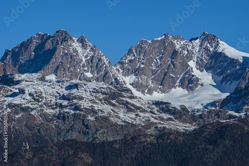 The mountains of Valtellina during a sunny winter day, near the town of Sondrio, Italy - January 2022