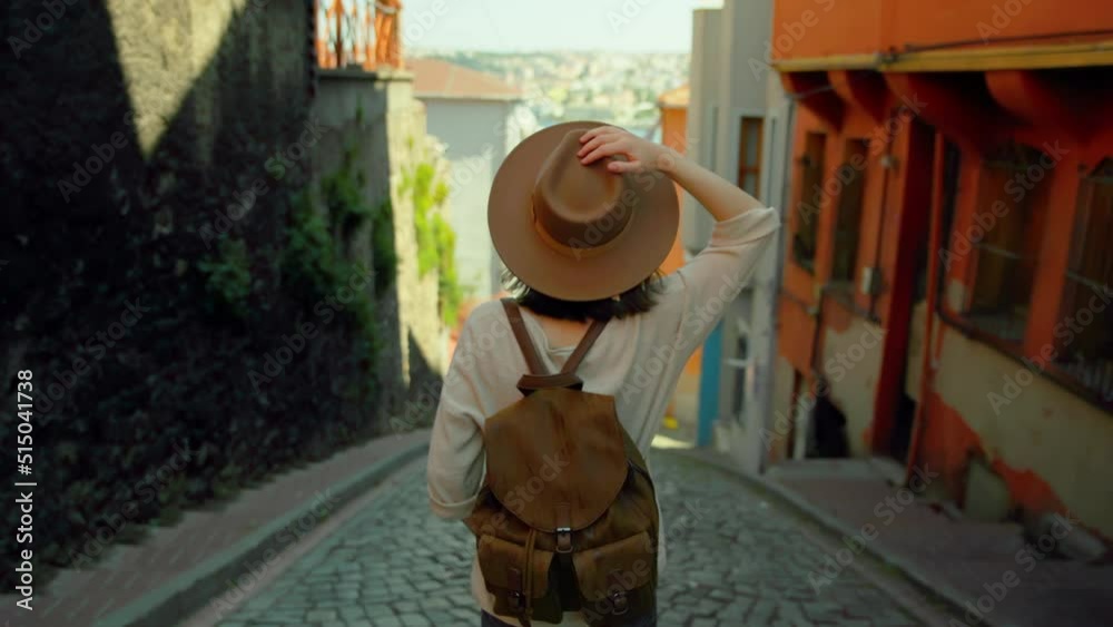 Young traveler woman in a hat standing on a turkish street in Istanbul
