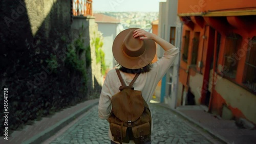 Young traveler woman in a hat standing on a turkish street in Istanbul