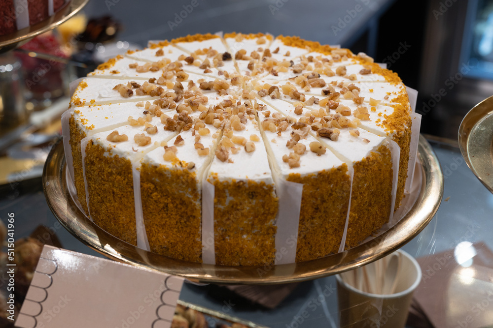 Cake Covered with Cream and Crushed Walnuts Cut into Single Serving Portions Cake Covered with Cream and Crushed Walnuts Cut into Single Serving Portions