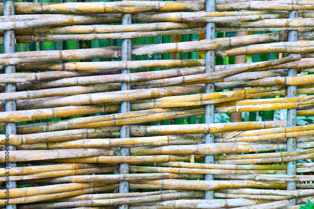 old grungy thai handcraft of bamboo weave pattern fence. old grungy thai handcraft of bamboo weave pattern fence.