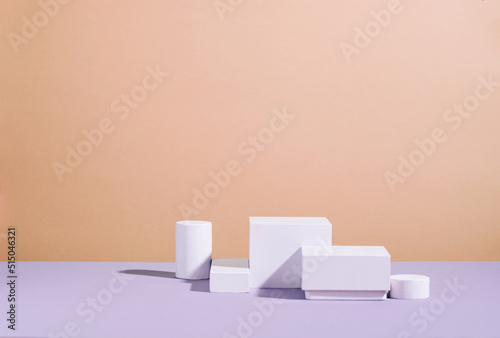 Creative modern podium various geometric shapes, pastel orange lilac empty background hard sunlight © ximich_natali