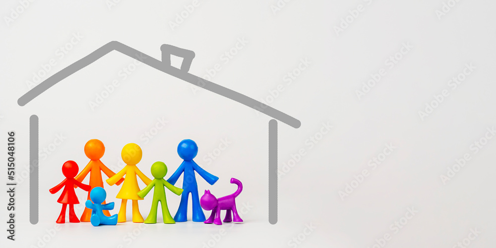 Figurines of colorful people on a light background. The concept of a traditional family. LGBT Community