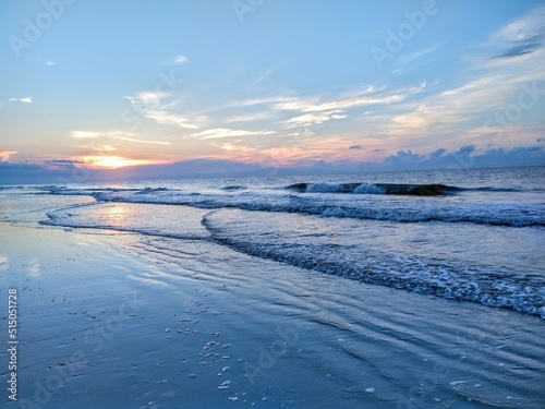 Beach Ocean Sunrise Over Rippling Stacked Waves © Connor Brennan