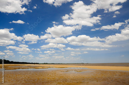 Cloudy morning in Santa Ana beach, near Juan Lacaze, Colonia, Uruguay. A sky-blue sky can be seen between clouds. photo