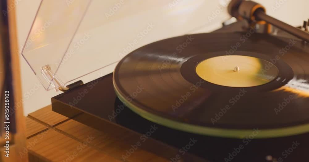 Close up of vinyl record spinning on turntable 