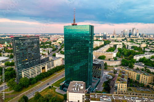 Warsaw, city centre panorama at sunset, business centre 2022. Sunset reflected in buildings.